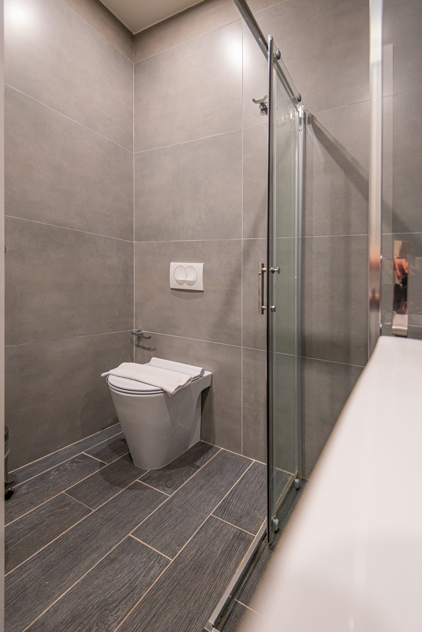 Triple Room bathroom with a toilet and shower